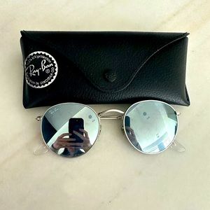 Authentic silver round metal Ray Bans in excellent condition with original case.